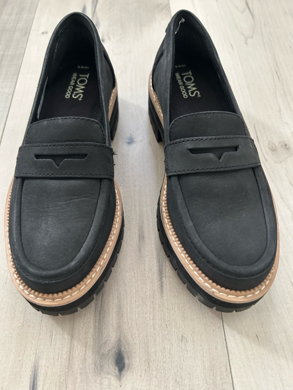 TOMS Black Leather Lug Sole Penny Loafers with Tan Welt